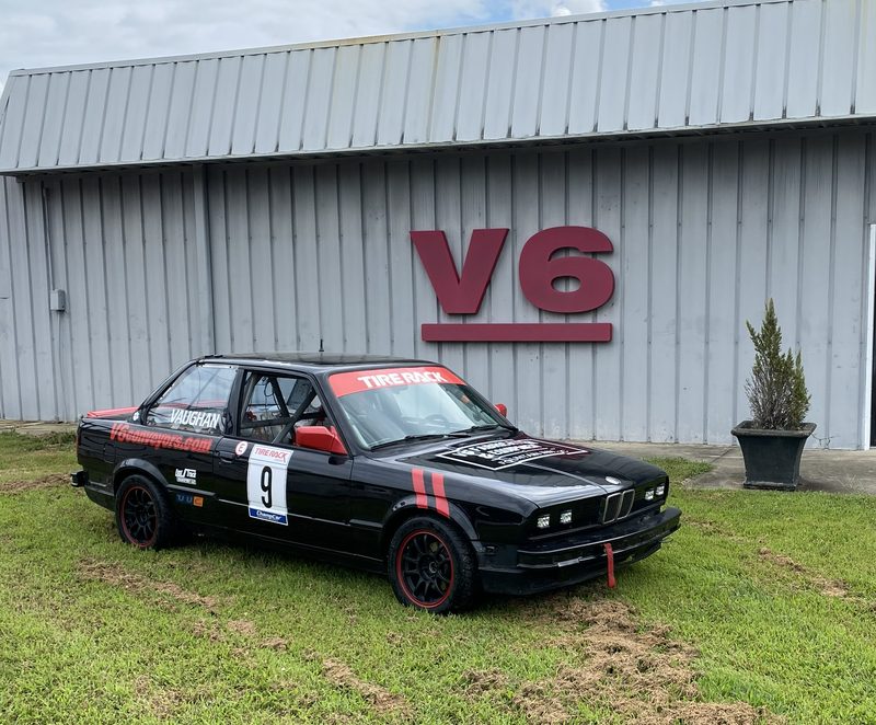 1988 BMW 325i in front of V6 Fabrication